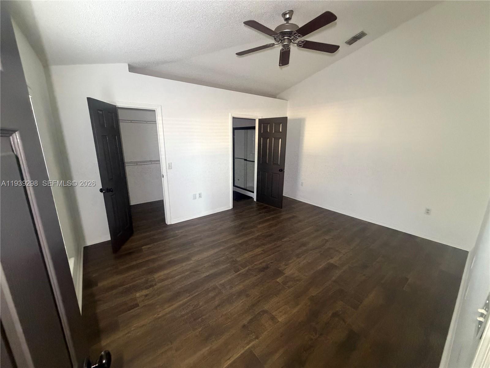 7 Zeidler Place Palm Coast, FL 32164 - Photo 8 of 26 an empty room with wooden floor and windows