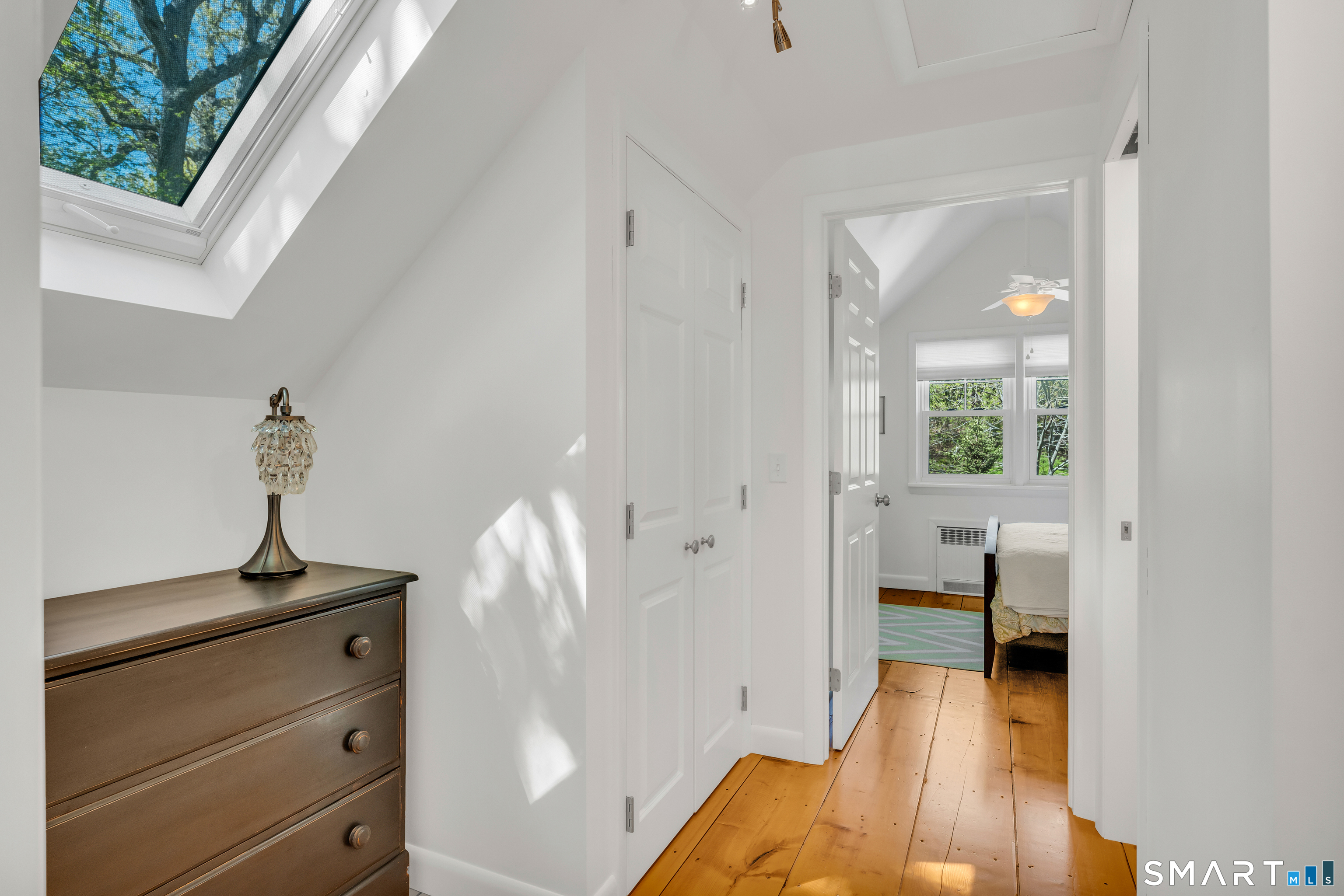 81 Main Street Chester, CT 06412 - Photo 19 of 39 The second floor is light and bright with the skylight at the top of the stairs.
