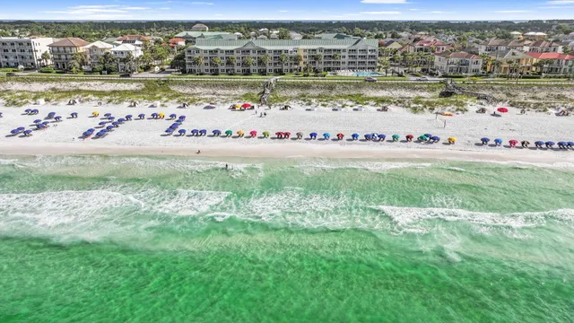 a view of a lake with houses in the back