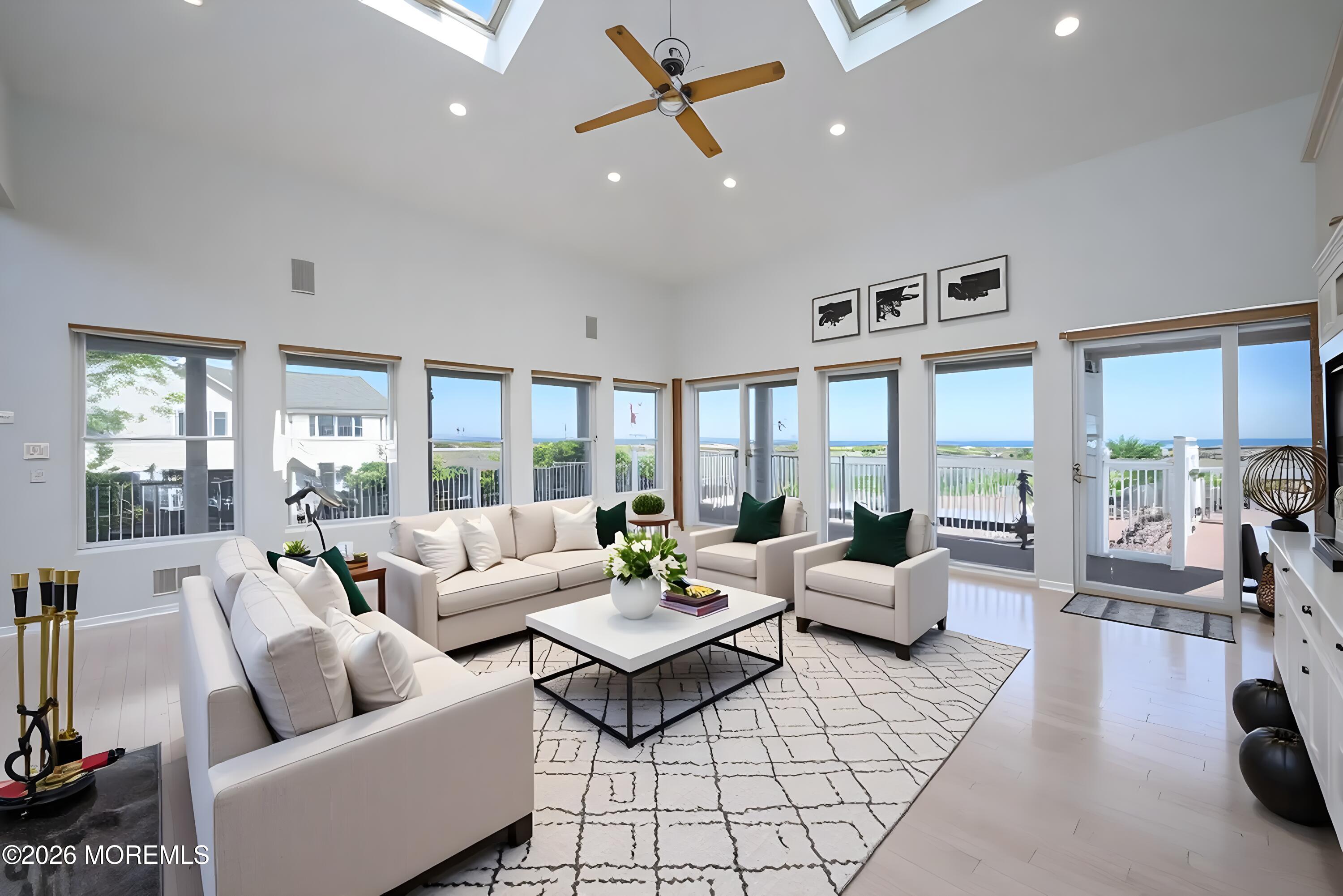 805 Front Street Union Beach, NJ 07735 - Photo 10 of 65 a living room with furniture and large windows