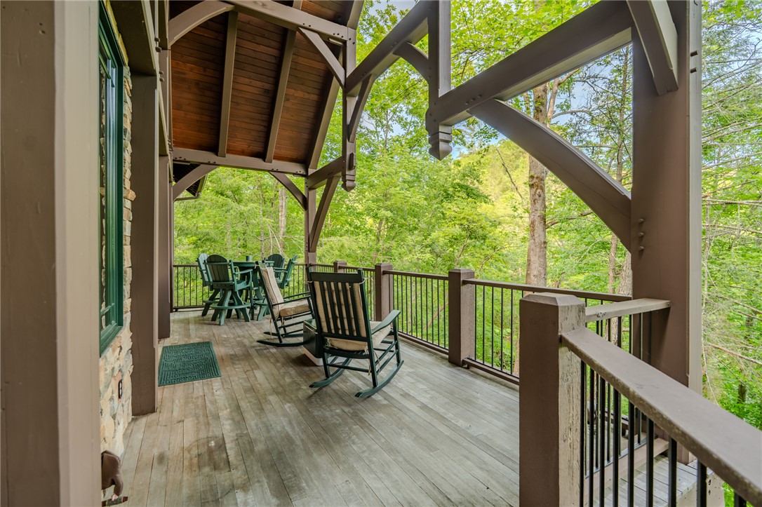 102 State Rd S-39-143 Sunset, SC 29685 - Photo 14 of 47 This inviting porch offers tranquil forest views, perfect for peaceful outdoor enjoyment.