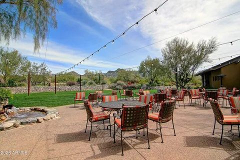 a view of a patio with a backyard