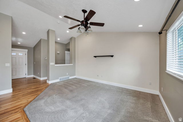 2912 South 1080th Street West Logan, UT 84321 - Photo 14 of 43 Carpeted living area with recessed lighting and a ceiling fan