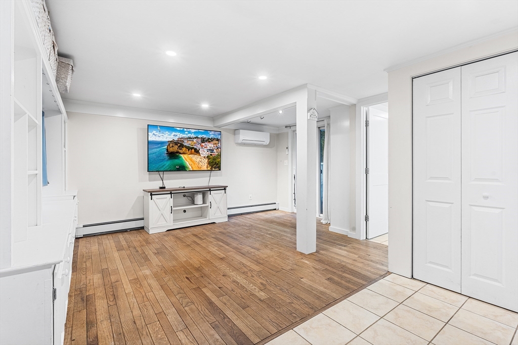 1052 Providence Road Northbridge, MA 01588 - Photo 13 of 42 a living room with furniture and a flat screen tv