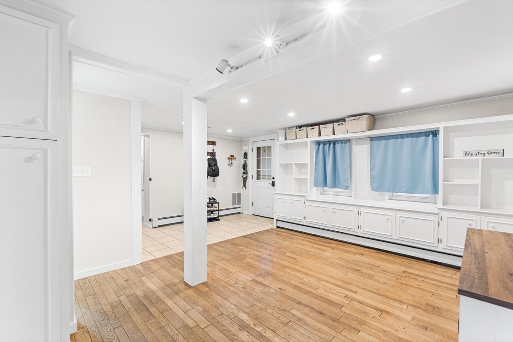 1052 Providence Road Northbridge, MA 01588 - Photo 14 of 42 a view of empty room with wooden floor and cabinet
