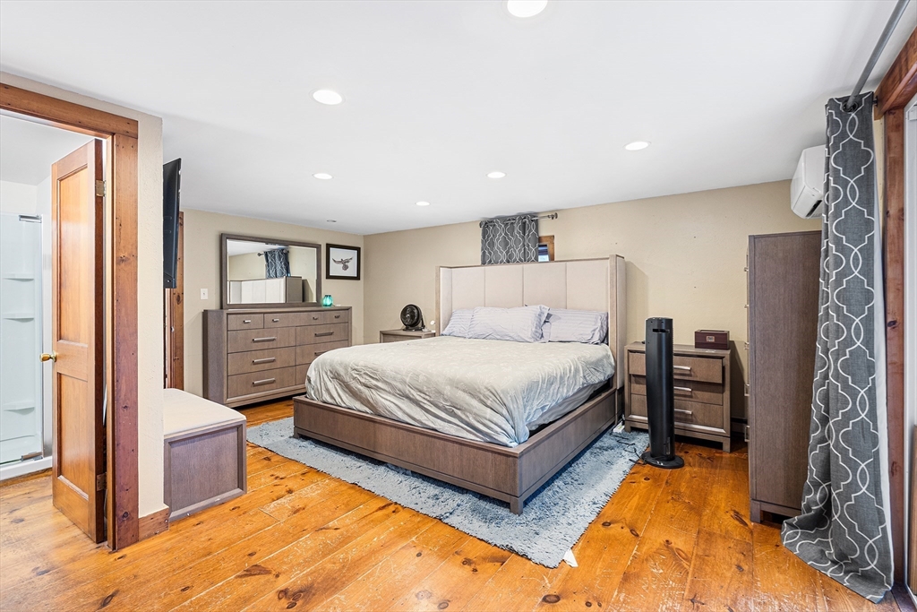 1052 Providence Road Northbridge, MA 01588 - Photo 20 of 42 a spacious bedroom with a bed and a large window