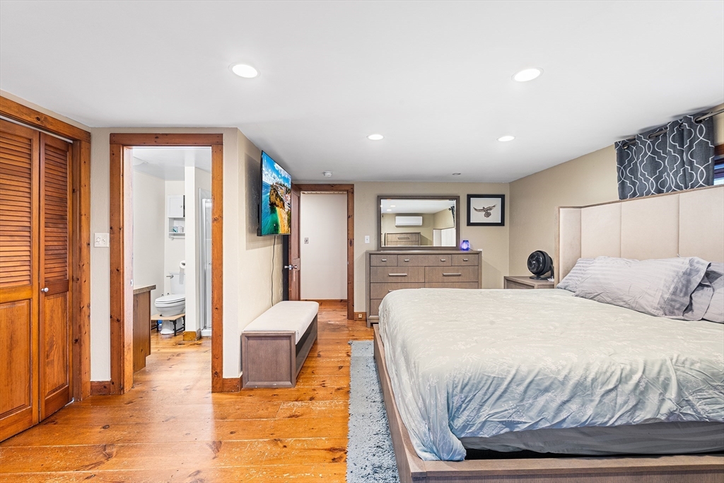 1052 Providence Road Northbridge, MA 01588 - Photo 21 of 42 a bedroom with a large bed and a couch