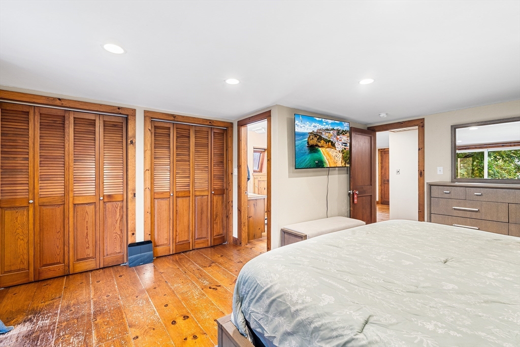 1052 Providence Road Northbridge, MA 01588 - Photo 22 of 42 a bedroom with a large bed and large windows