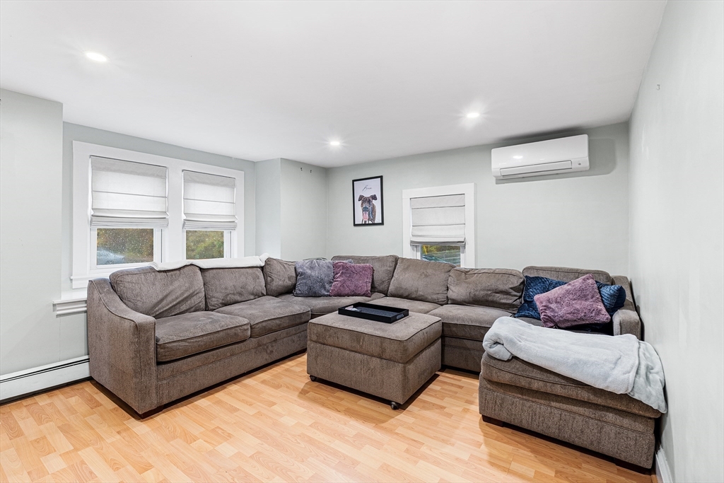 1052 Providence Road Northbridge, MA 01588 - Photo 3 of 42 a living room with a couch and a window