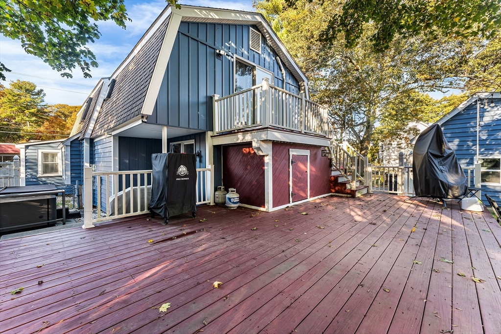 1052 Providence Road Northbridge, MA 01588 - Photo 32 of 42 a view of backyard with a deck and wooden floor