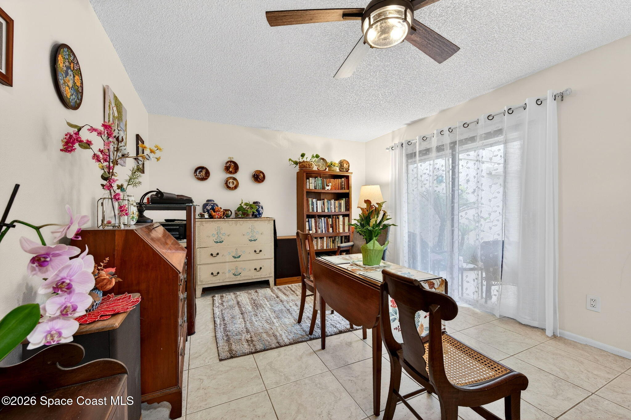 1400 Sheafe Avenue Northeast, Unit 110 Palm Bay, FL 32905 - Photo 15 of 35 a bedroom with furniture and a chandelier