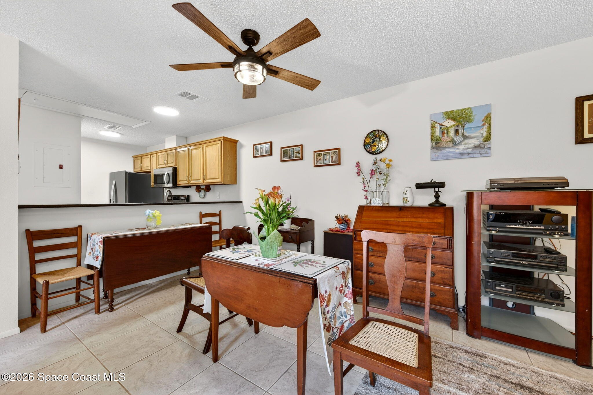 1400 Sheafe Avenue Northeast, Unit 110 Palm Bay, FL 32905 - Photo 18 of 35 a living room with furniture and a flat screen tv