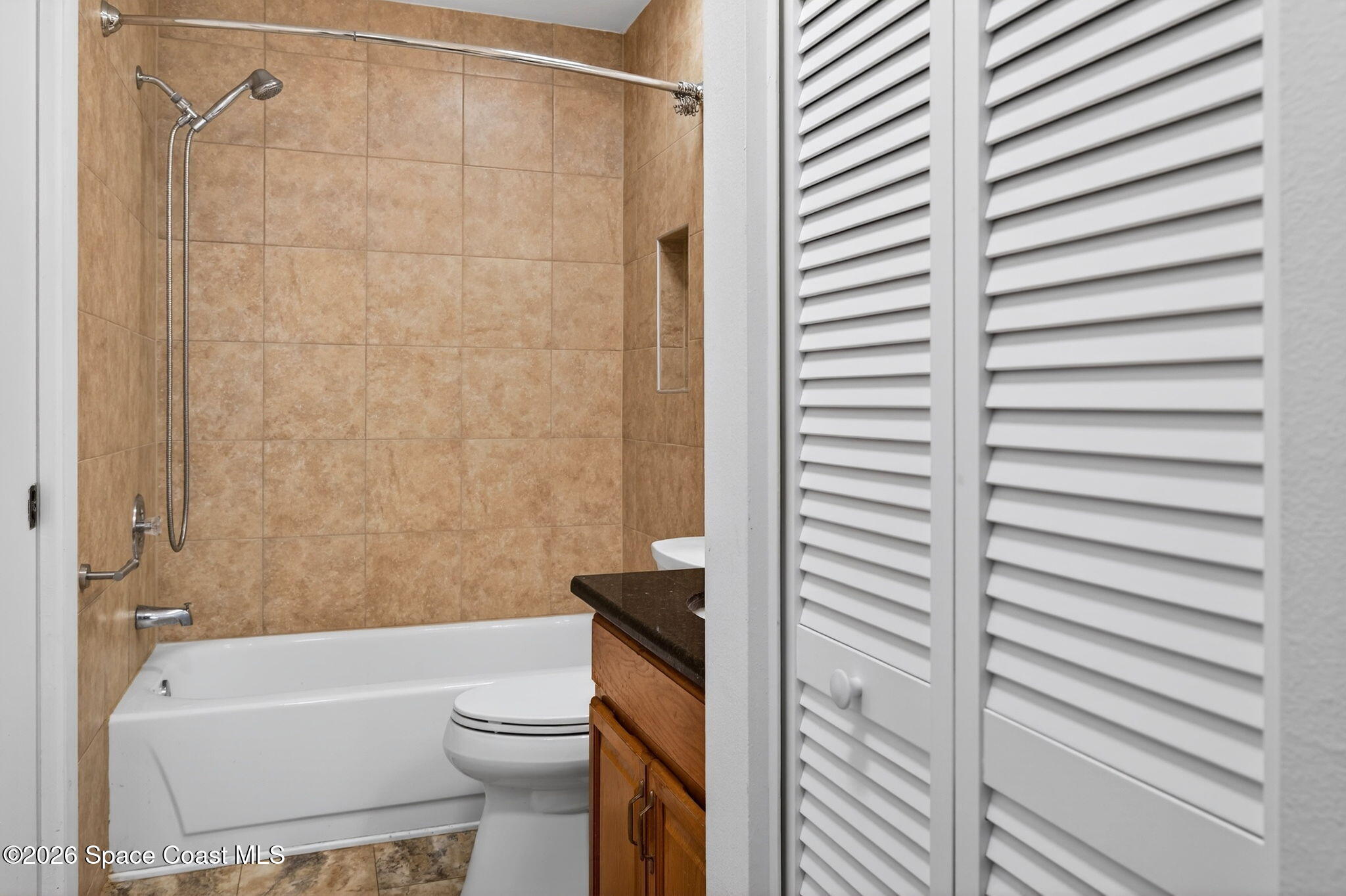 1400 Sheafe Avenue Northeast, Unit 110 Palm Bay, FL 32905 - Photo 24 of 35 a bathroom with a toilet and a bathtub