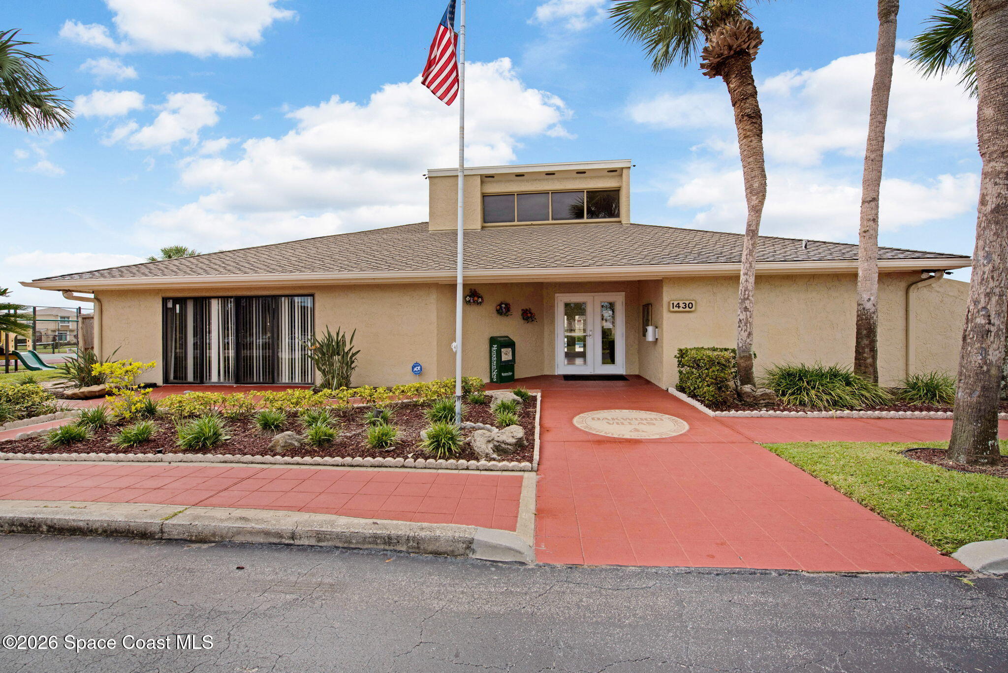 1400 Sheafe Avenue Northeast, Unit 110 Palm Bay, FL 32905 - Photo 30 of 35 a front view of a house with garden