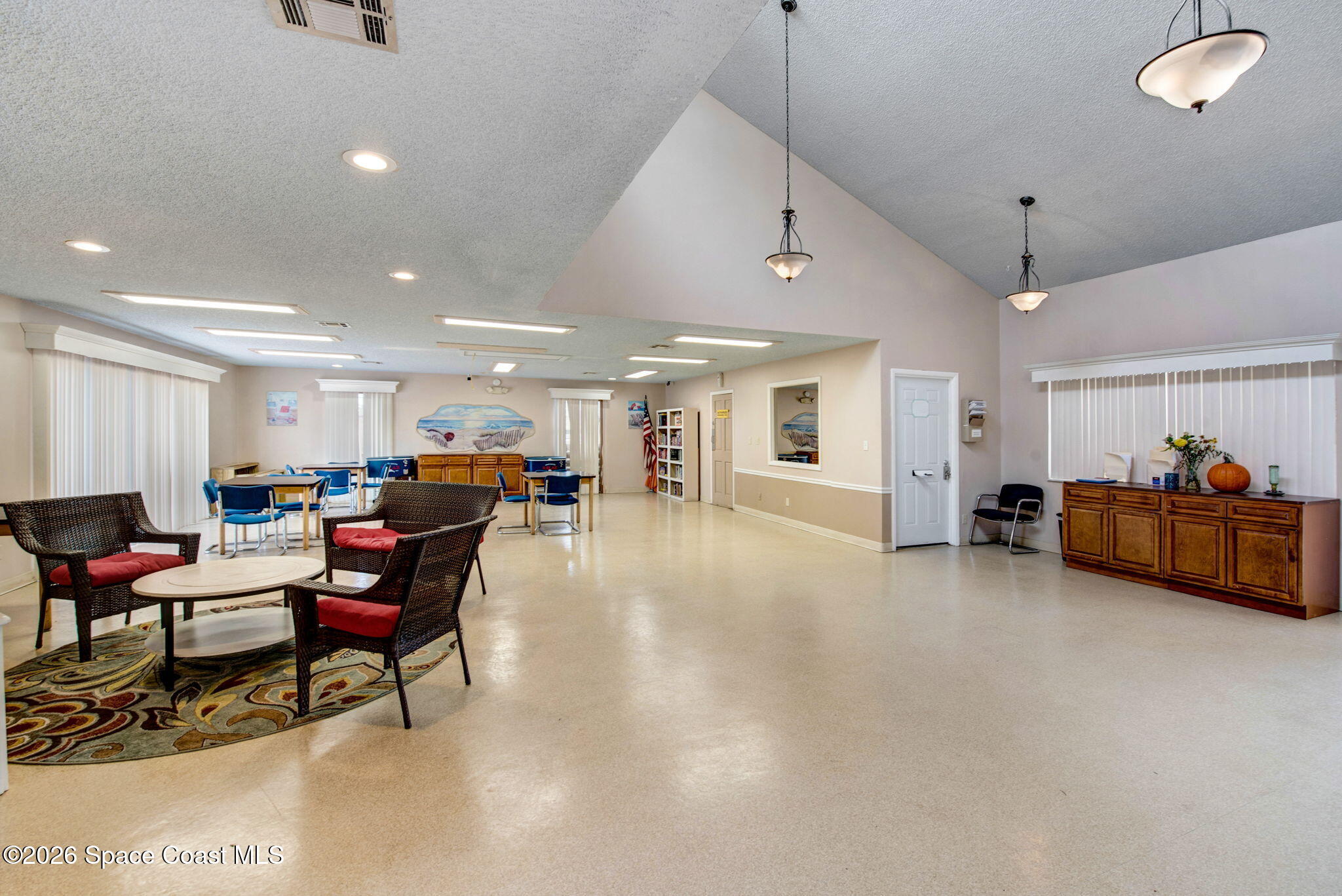 1400 Sheafe Avenue Northeast, Unit 110 Palm Bay, FL 32905 - Photo 35 of 35 a living room with furniture and a gym