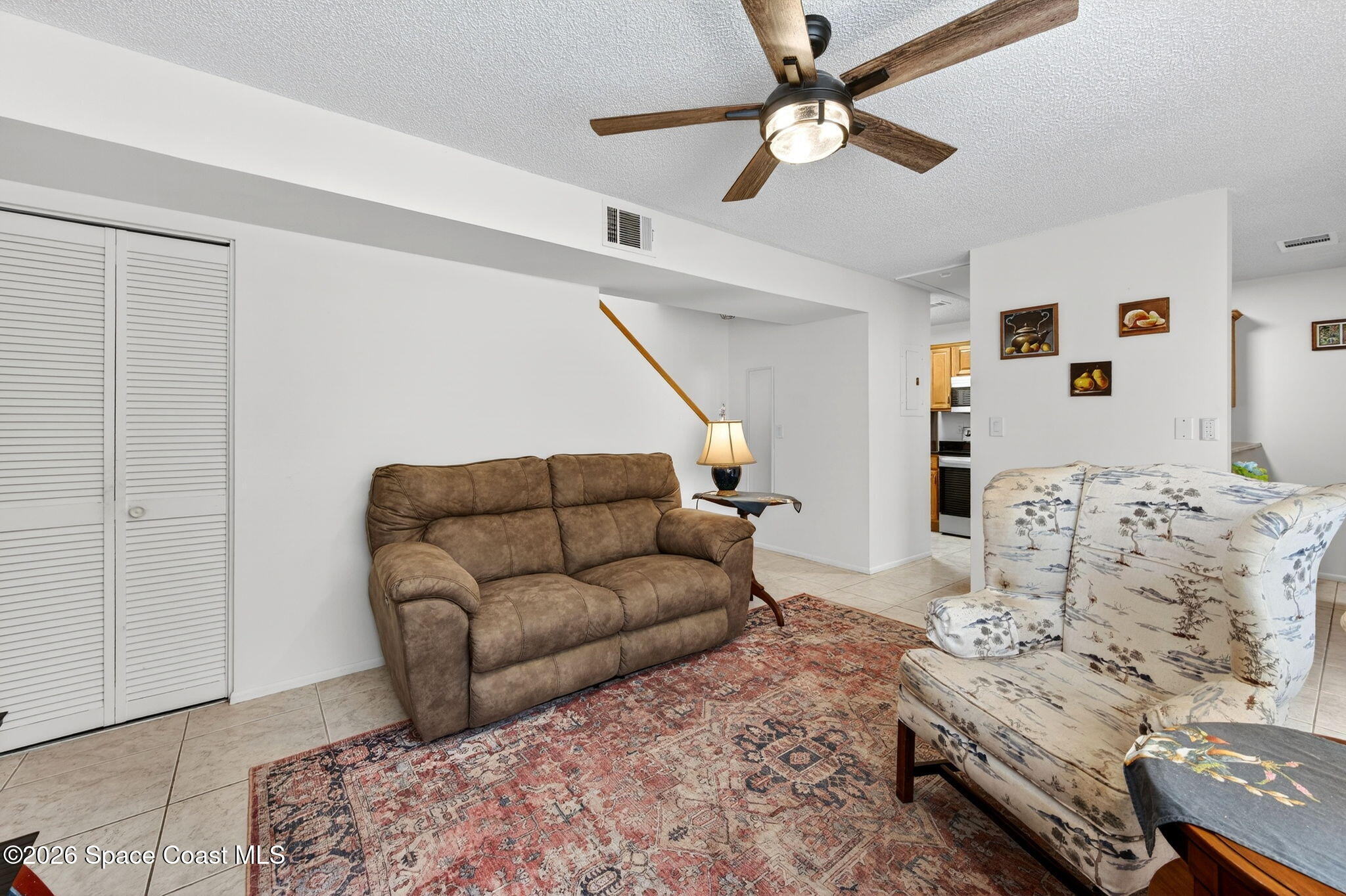 1400 Sheafe Avenue Northeast, Unit 110 Palm Bay, FL 32905 - Photo 8 of 35 a living room with furniture and a couch