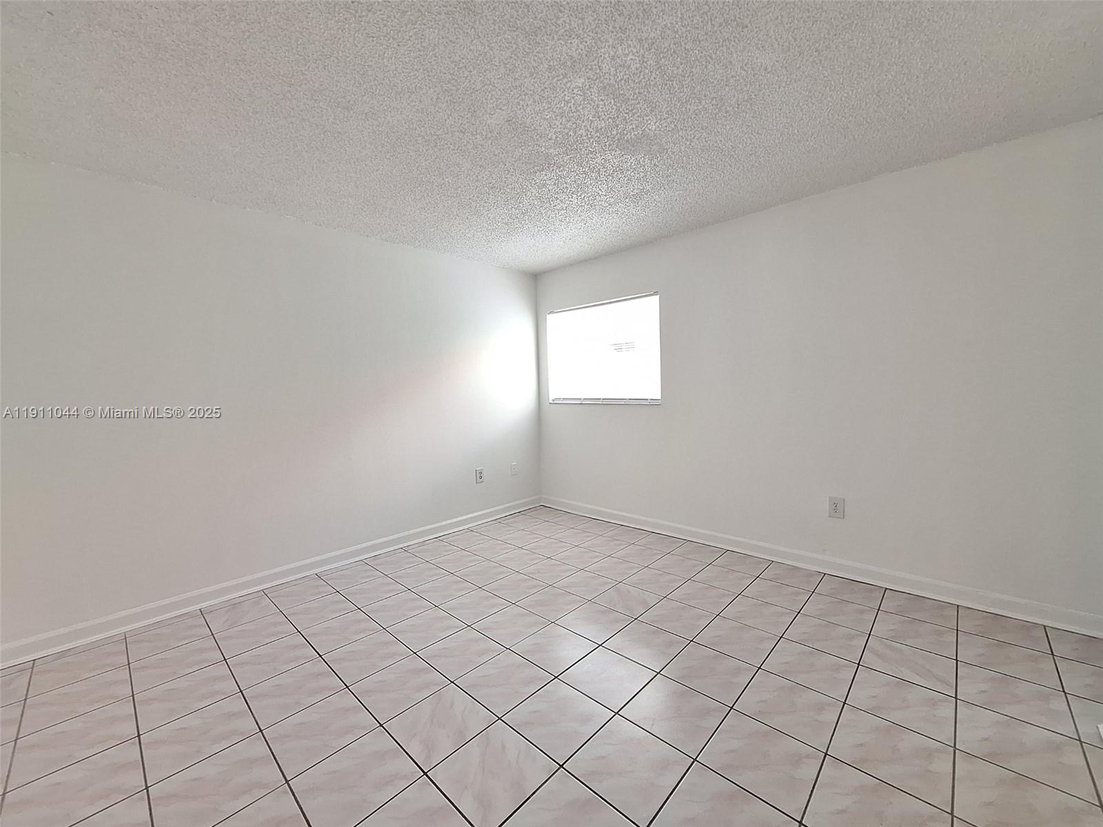 2011 Bay Drive, Unit 3 Miami Beach, FL 33141 - Photo 4 of 14 a view of an empty room and window