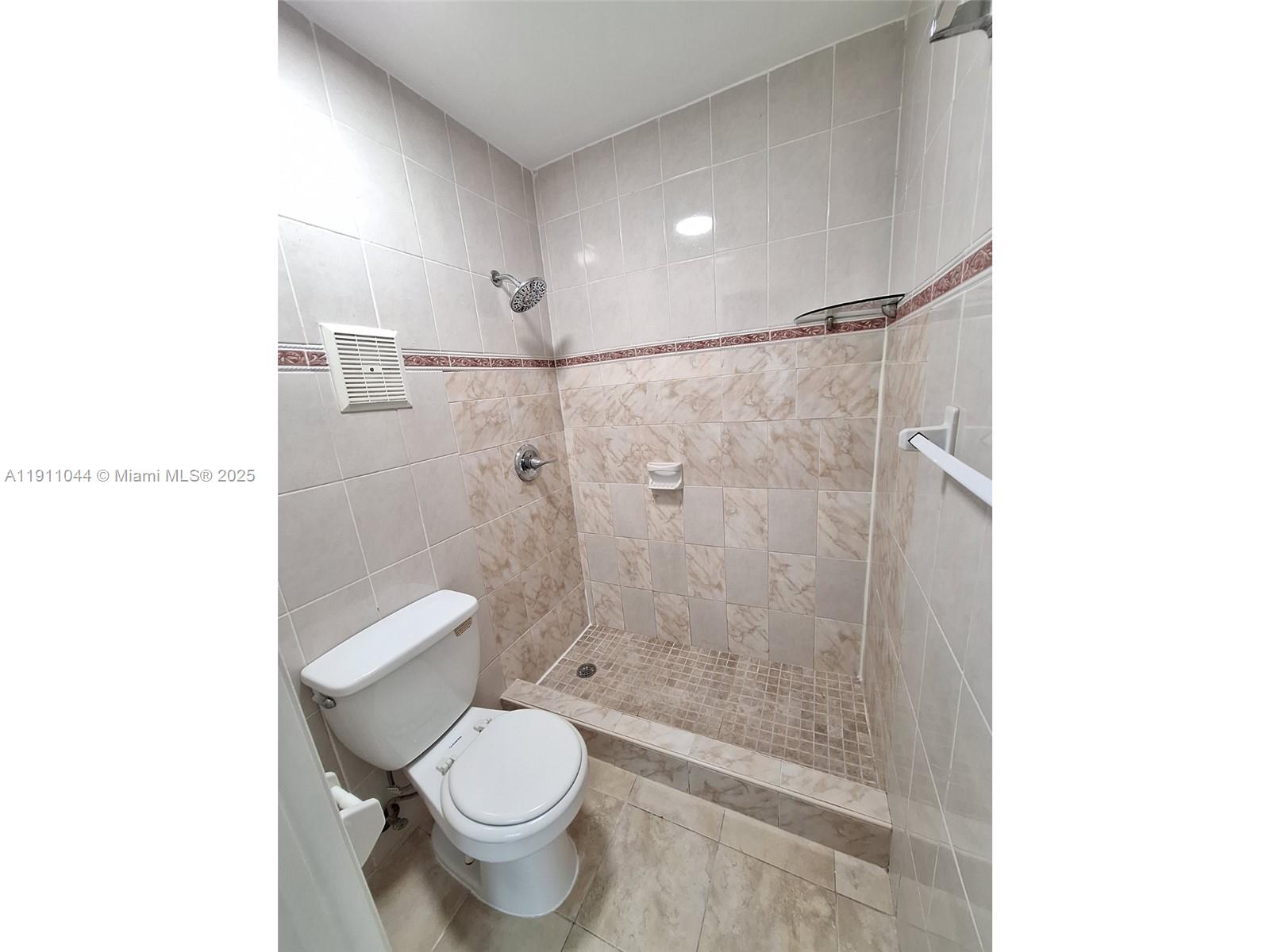 2011 Bay Drive, Unit 3 Miami Beach, FL 33141 - Photo 9 of 14 a bathroom with a toilet and a shower