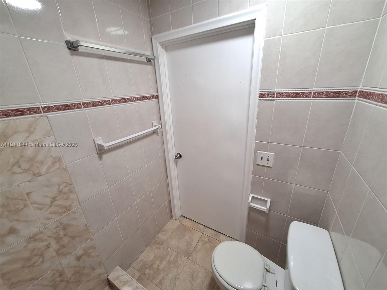 2011 Bay Drive, Unit 3 Miami Beach, FL 33141 - Photo 10 of 14 a bathroom with a toilet and a shower