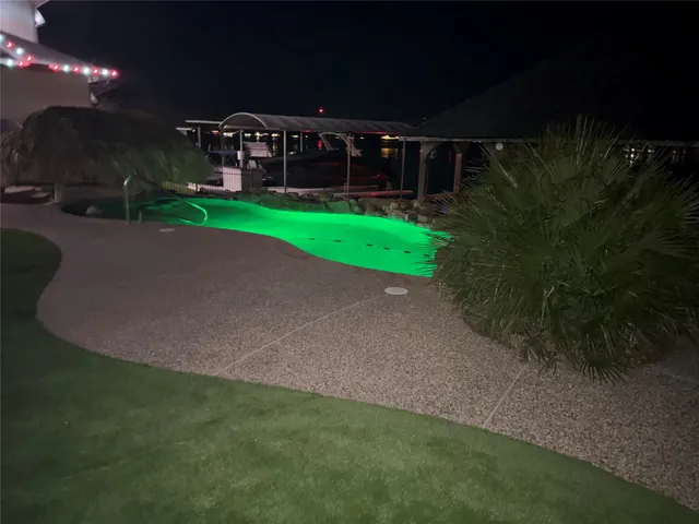 a view of a wooden deck front of house