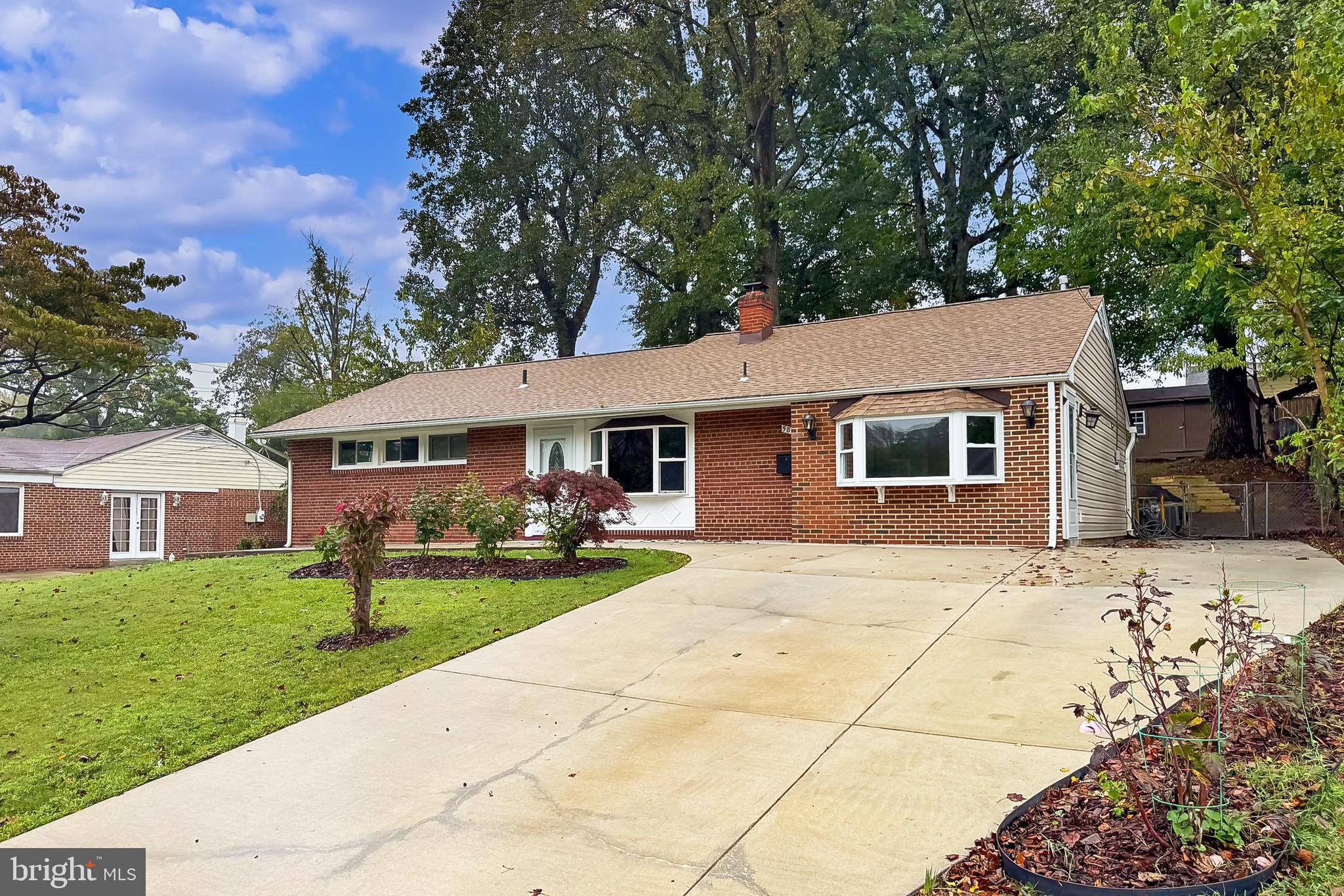 5807 Accomac Street Springfield, VA 22150 - Photo 13 of 50 a front view of a house with yard patio and green space
