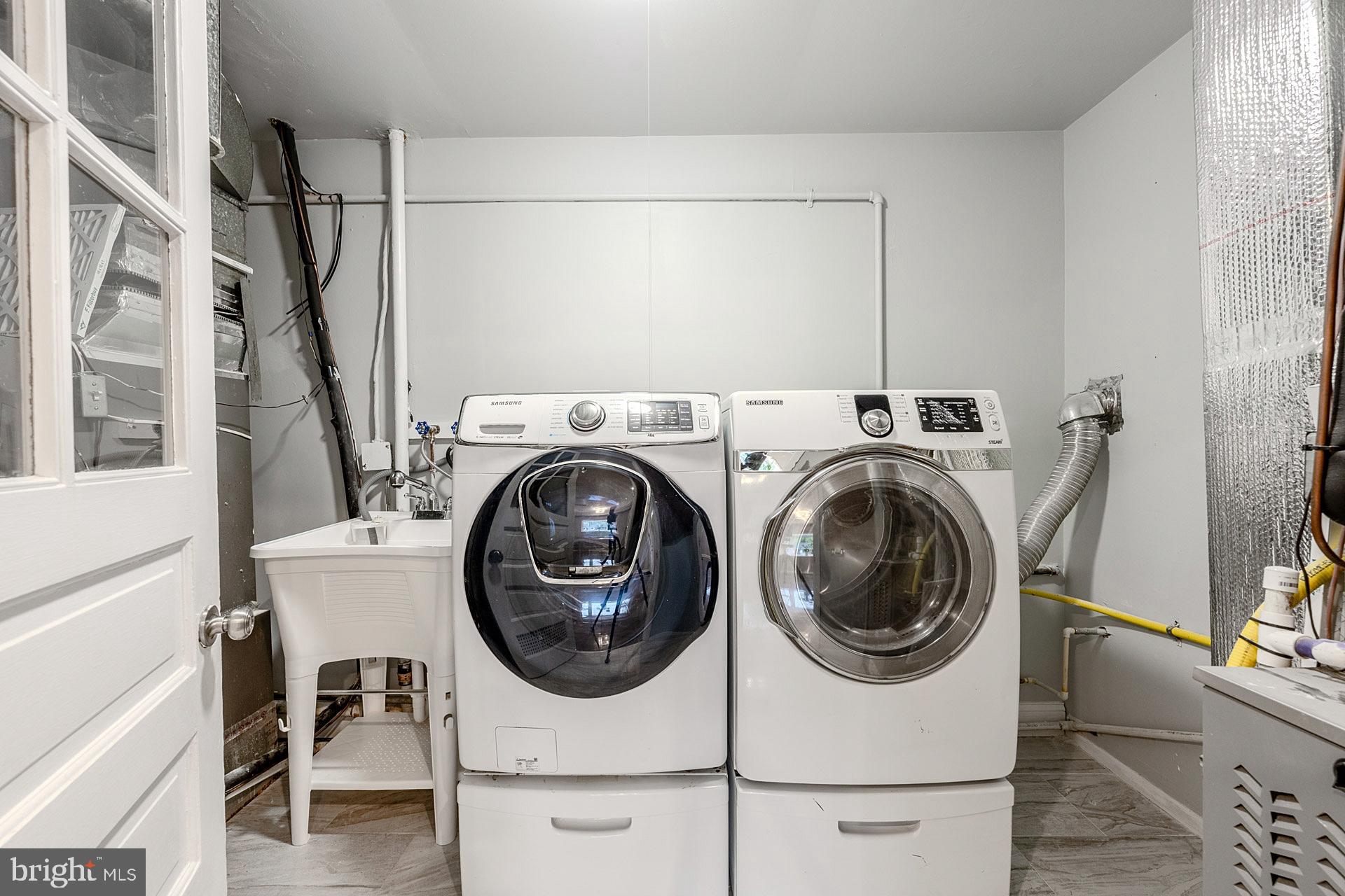 5807 Accomac Street Springfield, VA 22150 - Photo 32 of 50 a utility room with dryer and washer