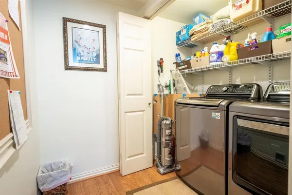a kitchen with stainless steel appliances a stove a refrigerator and cabinets