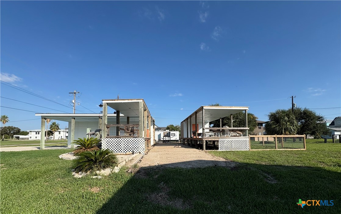 109 Washington Boulevard Port O'Connor, TX 77982 - Photo 11 of 23 a front view of a house with a yard