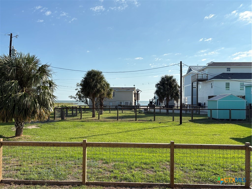109 Washington Boulevard Port O'Connor, TX 77982 - Photo 23 of 23 a swimming pool with outdoor seating and yard