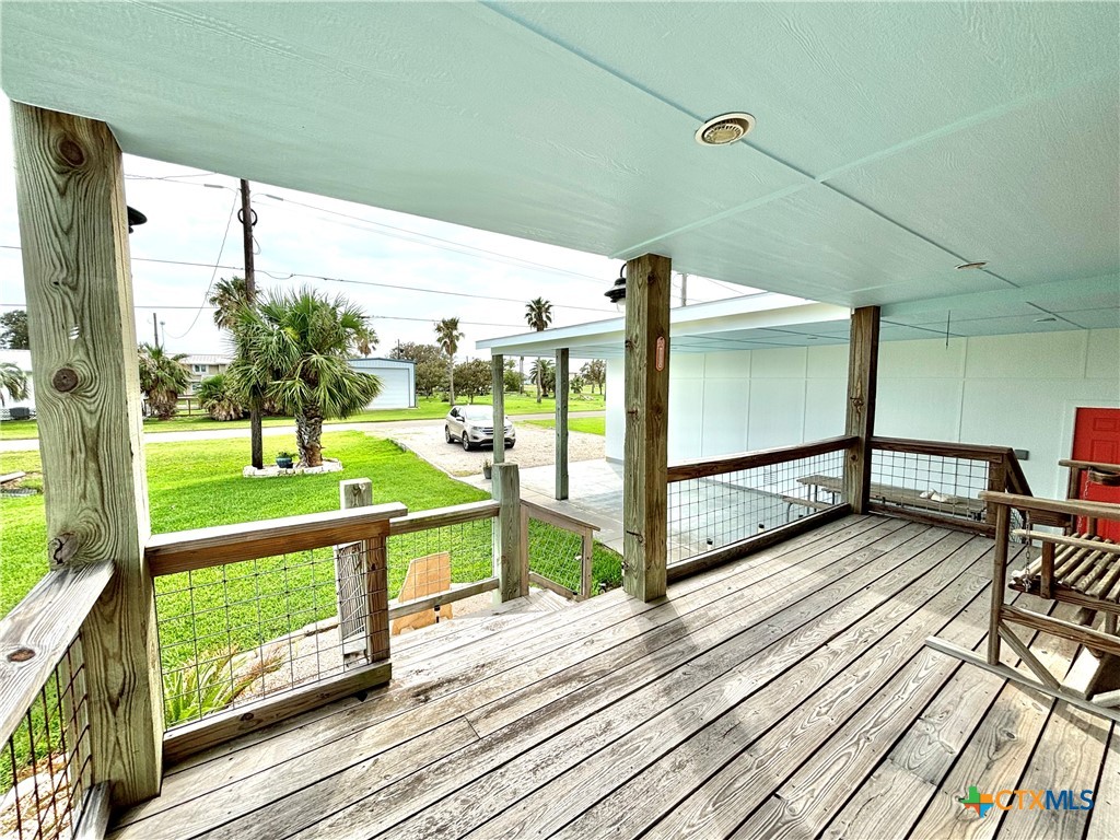 109 Washington Boulevard Port O'Connor, TX 77982 - Photo 8 of 23 a view of a balcony with wooden floor