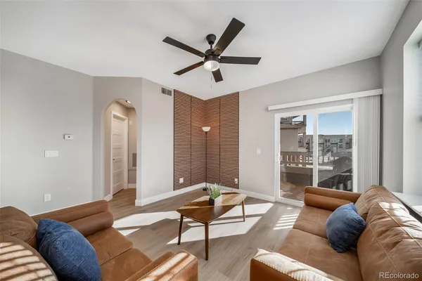 a living room with furniture and a window