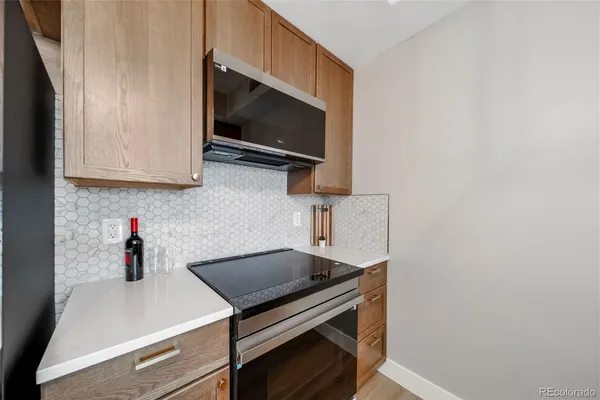 a kitchen with a stove and a microwave