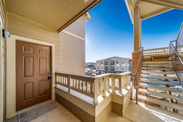 a view of a balcony with chairs