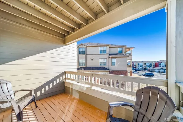 a view of a balcony with furniture