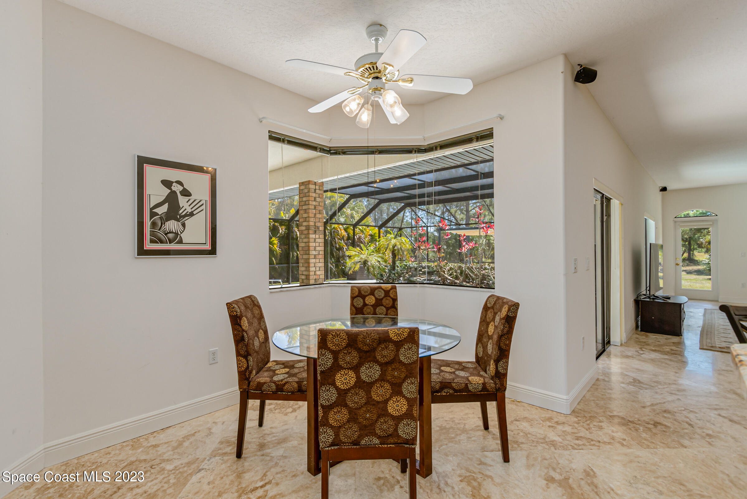 271 Deer Run Road Palm Bay, FL 32909 - Photo 18 of 61 a view of a dining room with furniture window and wooden floor