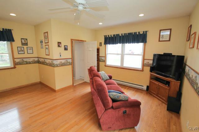 683 English Road Bath, PA 18014 - Photo 16 of 32 a living room with furniture a flat screen tv and kitchen view