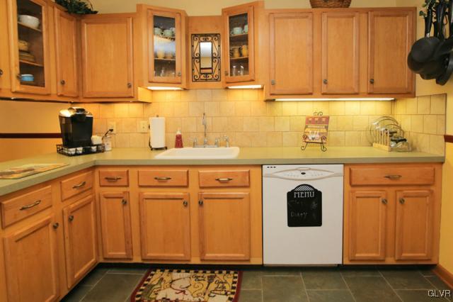 683 English Road Bath, PA 18014 - Photo 19 of 32 a kitchen with stainless steel appliances granite countertop a sink a stove and white cabinets