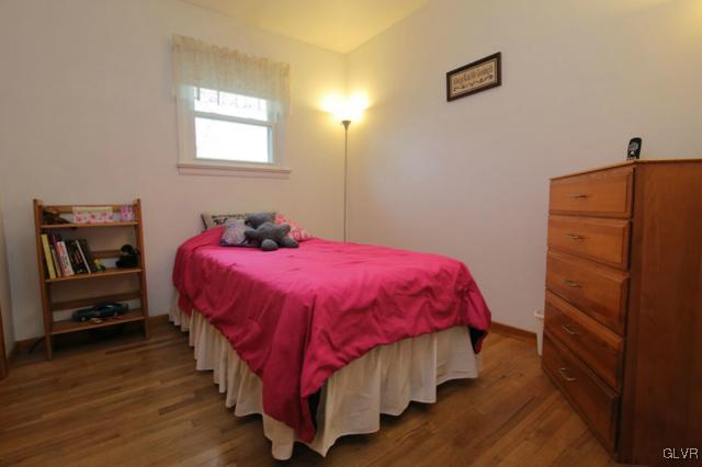 683 English Road Bath, PA 18014 - Photo 21 of 32 a bedroom with a bed and wooden floor