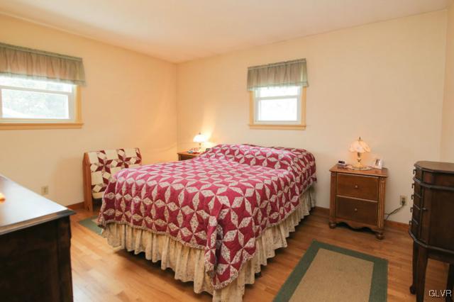 683 English Road Bath, PA 18014 - Photo 23 of 32 a bedroom with a bed and wooden floor
