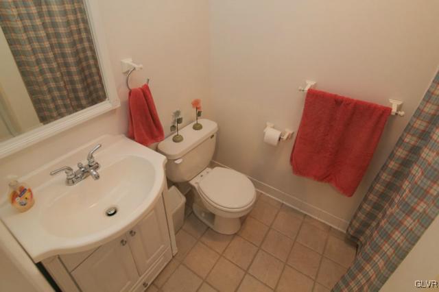 683 English Road Bath, PA 18014 - Photo 27 of 32 a white toilet sitting next to a bathroom sink