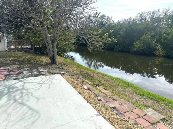 a view of lake with green space