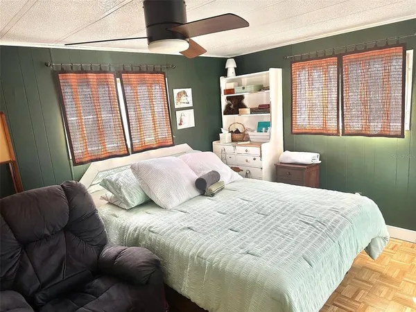 a bedroom with a bed and window