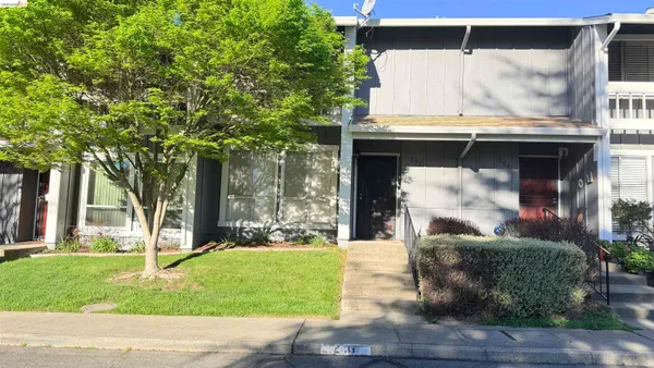 a view of an entryway with wooden floor and stairs