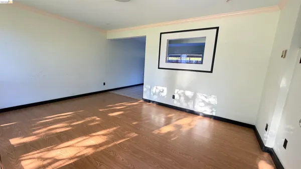 a view of a room with wooden floor and walls
