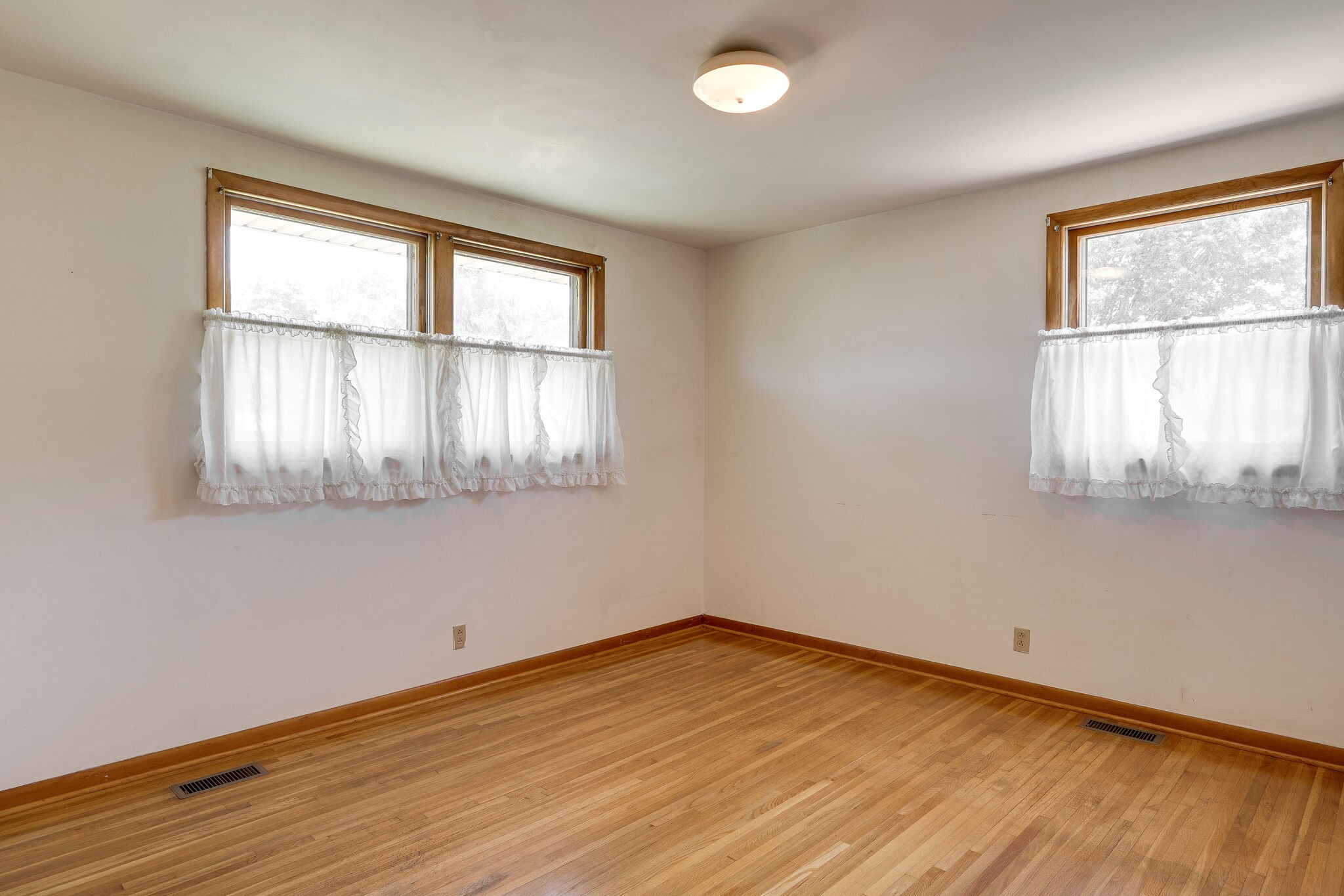 7524 Gary Road Joelton, TN 37080 - Photo 14 of 29 an empty room with wooden floor and windows