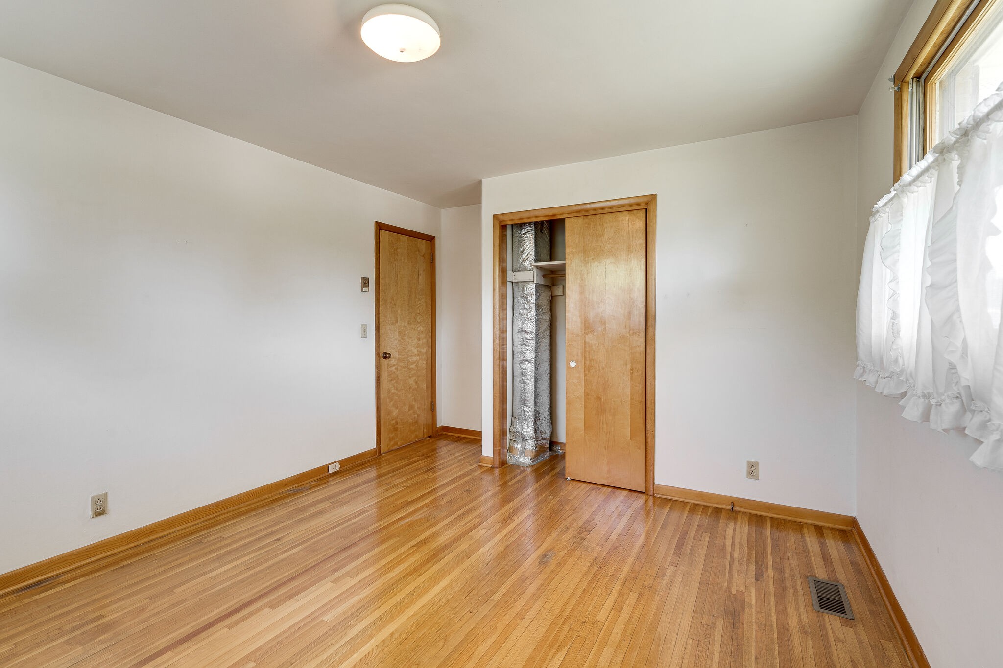 7524 Gary Road Joelton, TN 37080 - Photo 15 of 29 an empty room with wooden floor and windows
