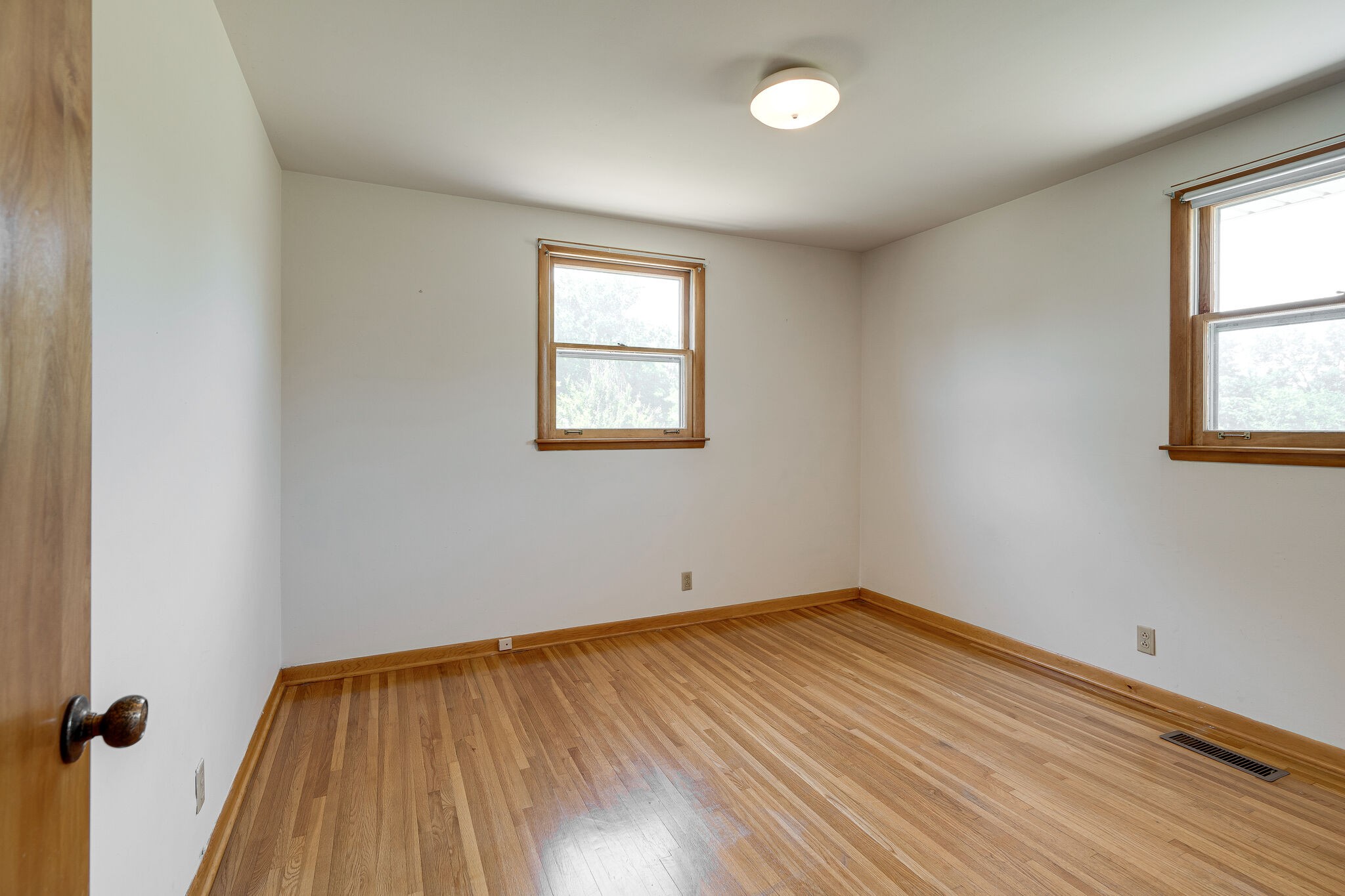 7524 Gary Road Joelton, TN 37080 - Photo 16 of 29 an empty room with wooden floor and windows