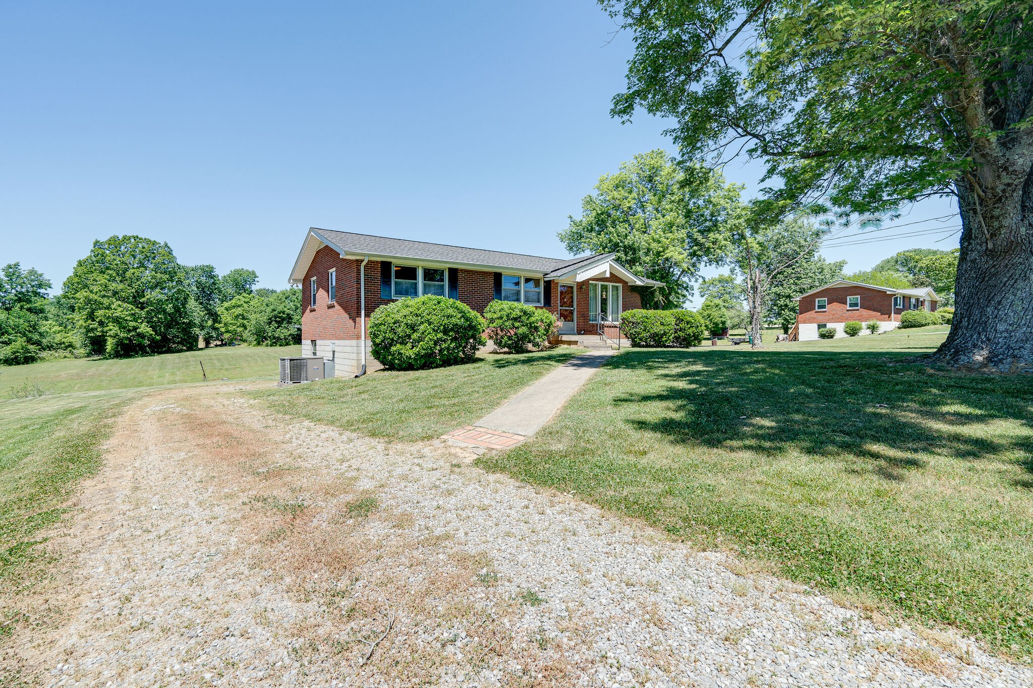 7524 Gary Road Joelton, TN 37080 - Photo 2 of 29 a front view of a house with garden