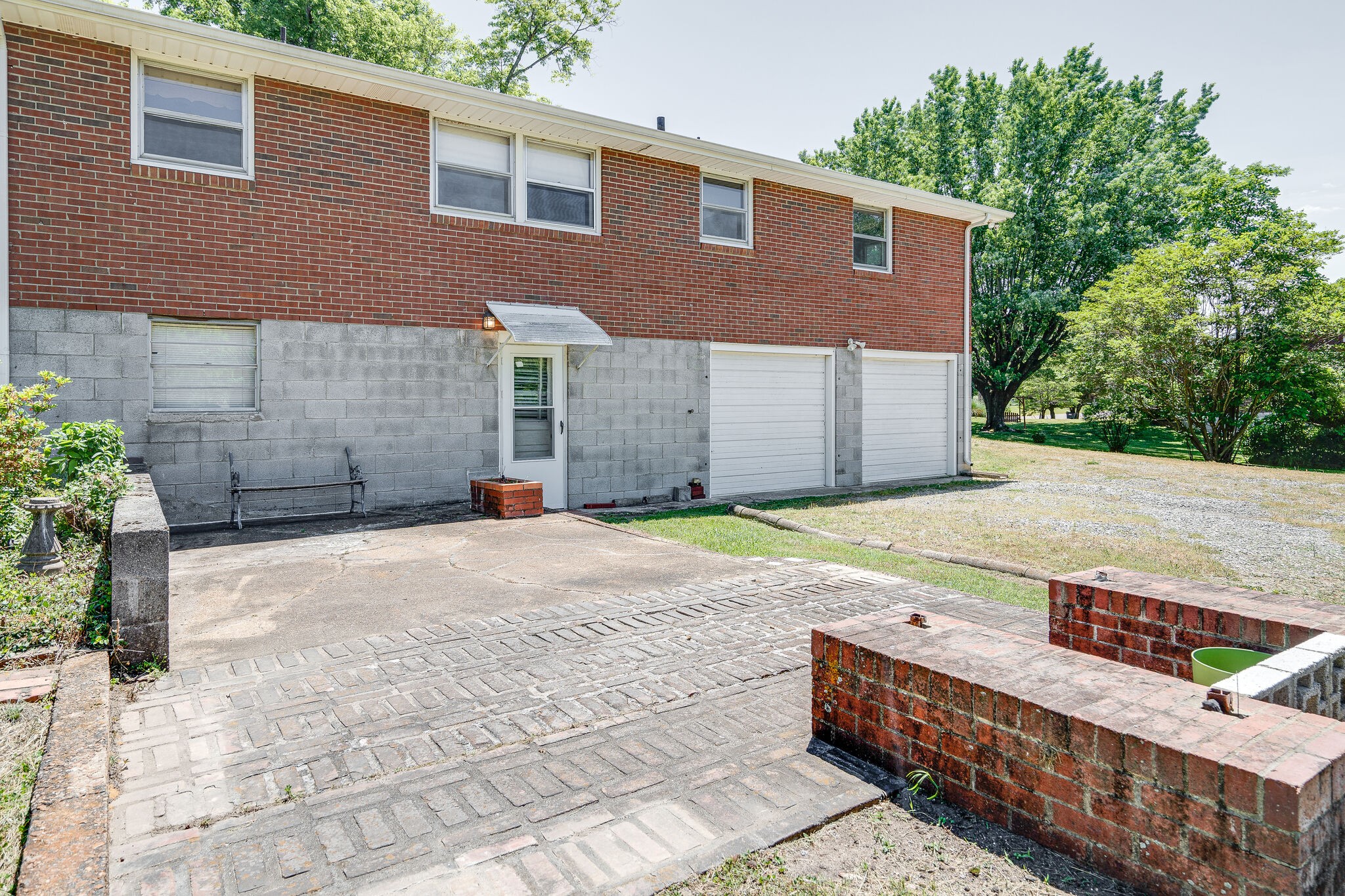 7524 Gary Road Joelton, TN 37080 - Photo 24 of 29 a house with yard and a wooden bench