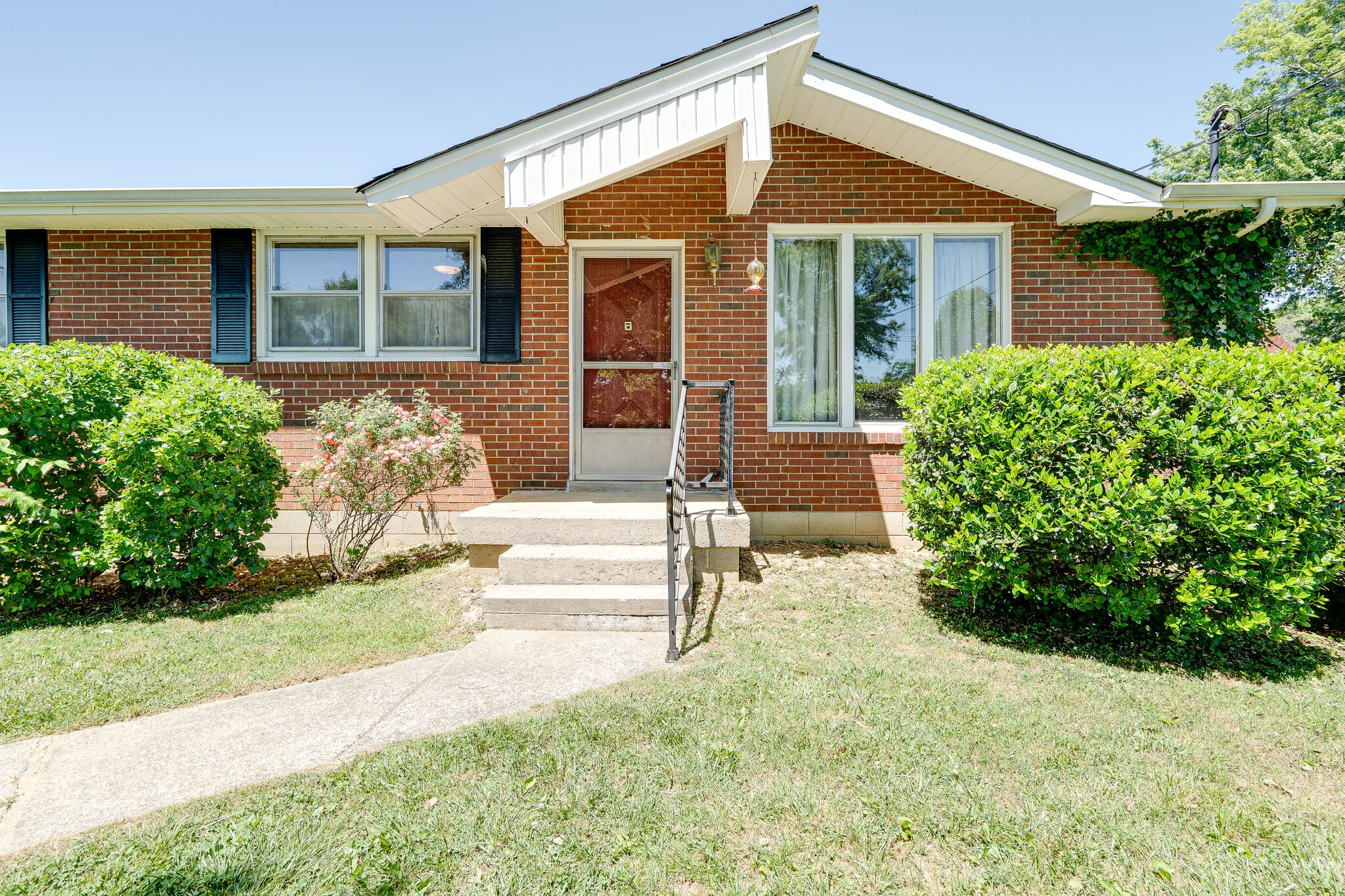 7524 Gary Road Joelton, TN 37080 - Photo 4 of 29 front view of a house with a yard